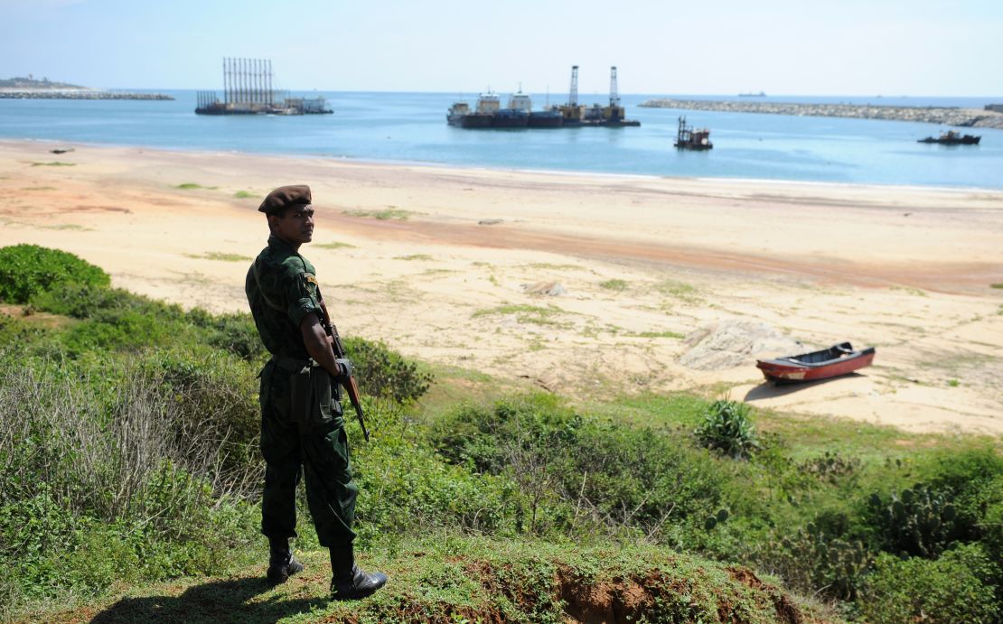 A Sri Lankan commando stands guard on the Hambantota construction site, November 18, 2010. 