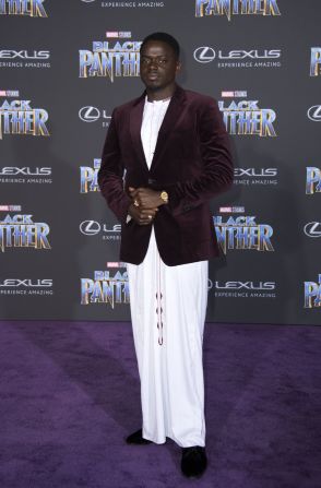 Daniel Kaluuya in maroon Burberry velvet blazer worn on a traditional Ugandan white kanzu.