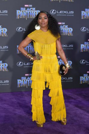 At 59, actor Angela Bassett looks beautiful as she rocks a classy neon-fringed Naeem Khan jumpsuit. Angela Bassett is T'Challa's mother Ramonda in Black Panther.