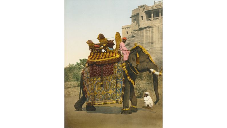 <strong>4. The Road to the Orient: </strong>Decked out in colorful cloth, an elephant readies for a South India procession in 1900, 47 years before the country established independence from Britain.