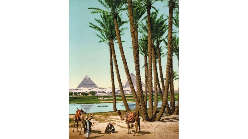 <strong>4. The Road to the Orient:</strong> In 1900, Bedouin people pose with camels in front of the Giza pyramids. Some travelers continued through Egypt to Victoria Falls, first seen by Europeans in 1855, when Scottish explorer David Livingstone was mapping the Zambezi River.