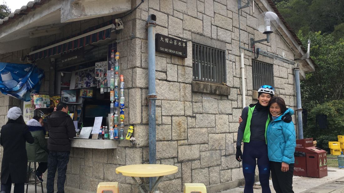<strong>The kiosk: </strong>As the only spot on the mountain serving drinks and foods to tired hikers and cyclists, Tai Mo Shan Kiosk and its owner, Kong Fo Lin (on the right), have become a beloved icon of the area. 