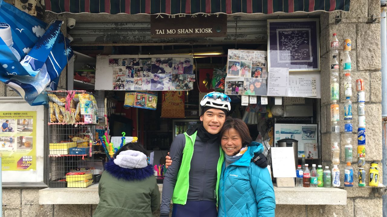 Kong Fo Lin (right), the owner of the Tai Mo Shan Kiosk, is the unofficial spokesperson of the mountain.