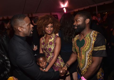 (L-R) Golden Globe winner Sterling K. Brown and his wife Ryan Michelle Bathe and son Andrew Brown with actor David Oyelowo in detailed African prints.