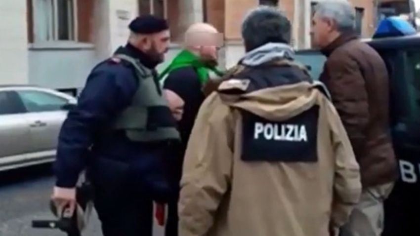 A photo of the alleged shooter being arrested by police. A number of foreign nationals were injured when shots were fired in the Italian city of Macerata.
