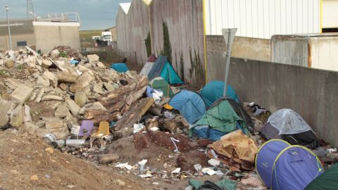 Migrants living in tents in February 2018 in Calais, France, rely on aid groups to survive.