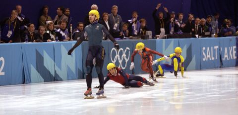 Australia's first ever Winter Gold medal winner Steven Bradbury crosses the line while America's Apolo Anton Ohno scrambles for the line to claim second place after the men's 1000m speed skating final during the Salt Lake City Winter Olympic Games in 1980.
