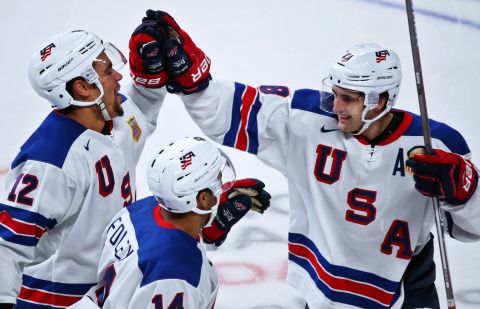US players Jordan Greenway, Eric Foley and Colin White celebrate winning in the IIHF World Junior Championship semifinals between the national teams of US and Russia.