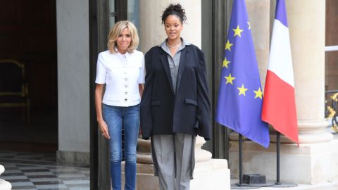 Brigitte Macron, wife of the French president, escorts Rihanna after a meeting with the French president at the Elysee Palace in Paris on July 26, 2017.