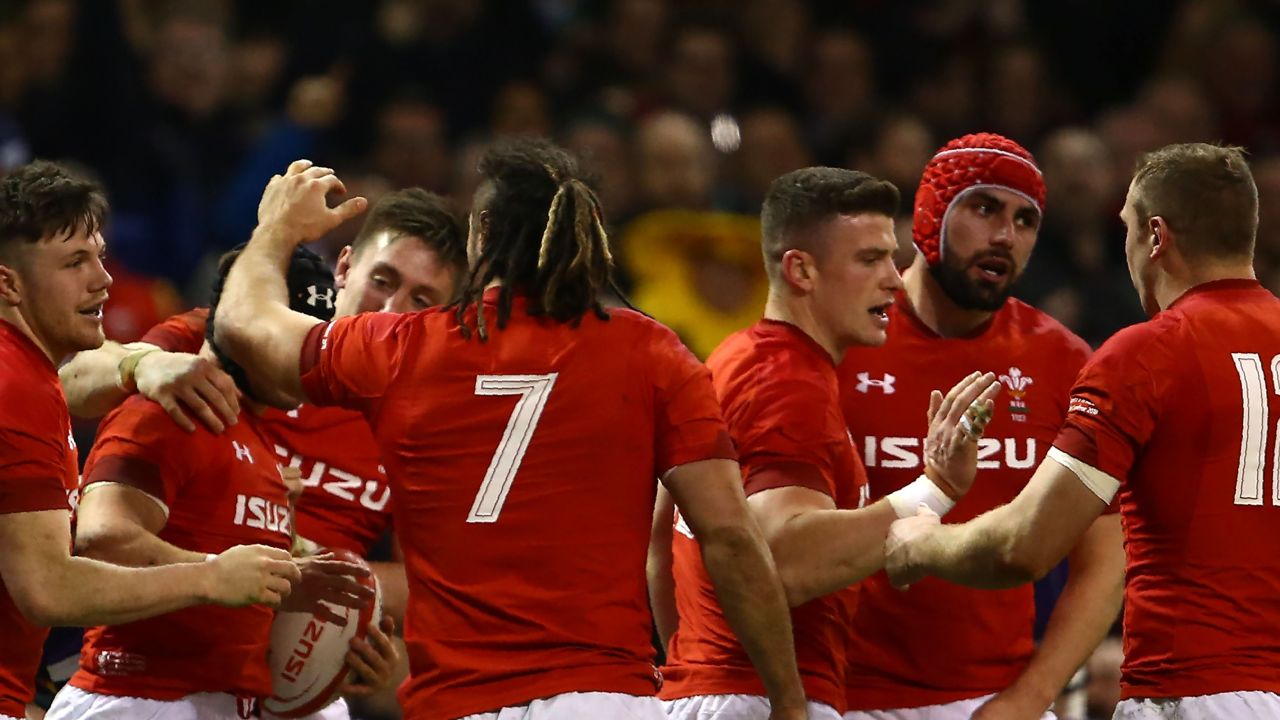 Wales players celebrate after scoring against Scotland.