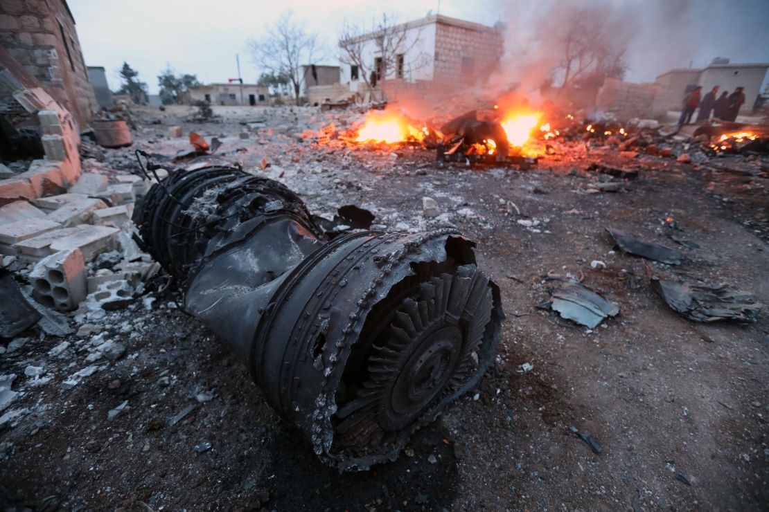 Smoke billows from the site of a downed Sukhoi-25 fighter jet in Syria's northwest province of Idlib.