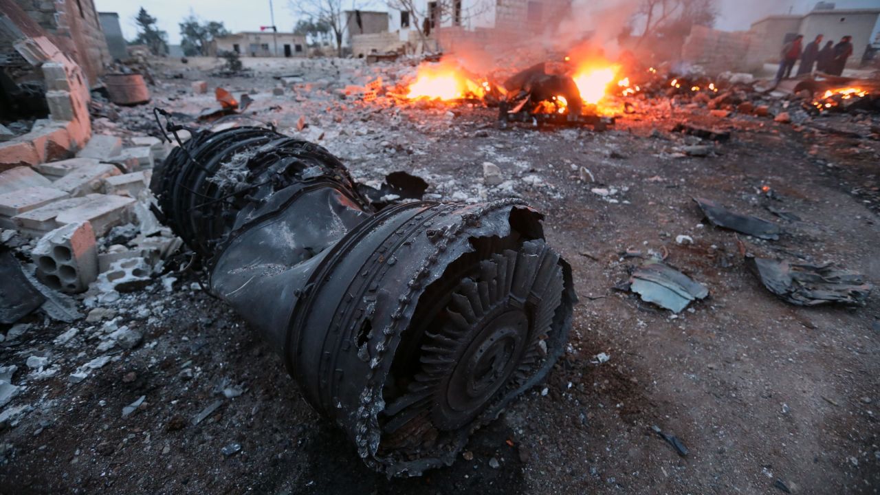 A February 3 picture shows smoke billowing from the site of a downed Russian jet in Idlib, northwest Syria.