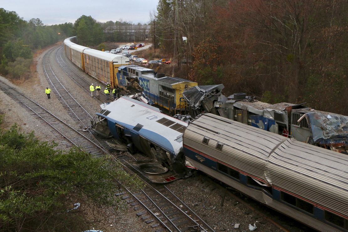 Authorities investigate the scene of a fatal Amtrak train crash in Cayce, South Carolina. 