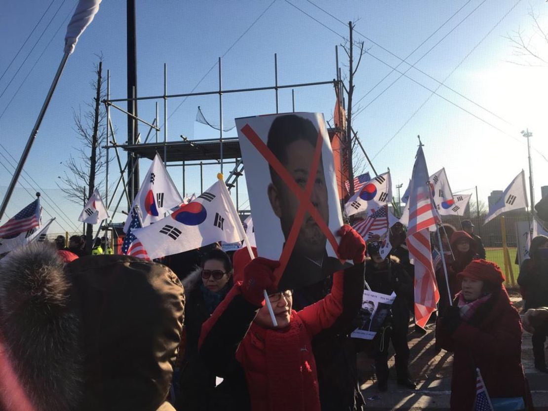 Anti-North Korea protesters gather outside Seonhak International Ice Rink ahead of Korea's friendly against Sweden.