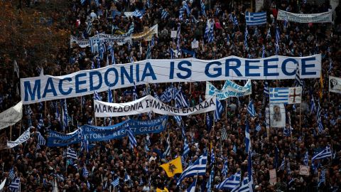 Protesters gather during a rally in Athens, Sunday, February 4, 2018.