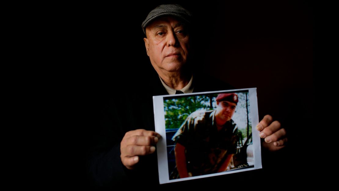 Miguel Perez Sr. holds a photo of his son, Miguel Perez Jr., on April 4 in Chicago.