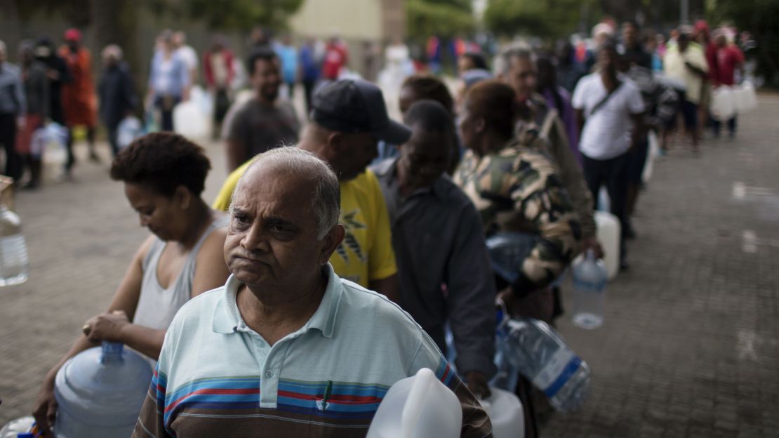 Residents queue to fill water containers in Cape Town on Friday.