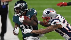 Philadelphia Eagles running back Corey Clement (30) carries the ball as New England Patriots strong safety Patrick Chung (23) and Patriots defensive back Brandon King (36) defend during the first quarter in Super Bowl LII at U.S. Bank Stadium. Mandatory Credit: John David Mercer-USA TODAY Sports
