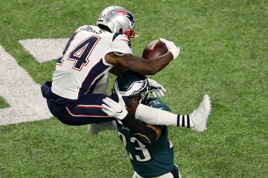 New England wide receiver Brandin Cooks is tackled by Philadelphia's Rodney McLeod as he tries to hurdle him during the second quarter.