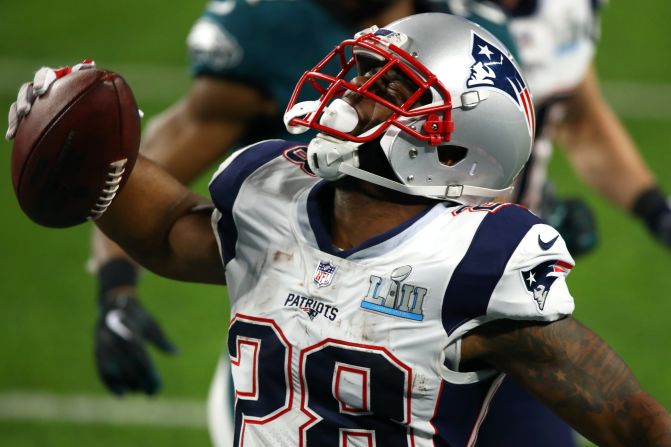 New England's James White celebrates after scoring a 28-yard touchdown run in the second quarter. The Eagles still led 15-12 after New England missed the extra point.