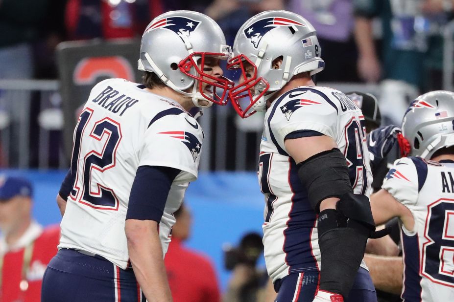 Brady, left, celebrates with Gronkowski after they linked up for a 5-yard touchdown pass on the first drive of the second half. New England moved within three points of Philadelphia, who led 22-12 at halftime.