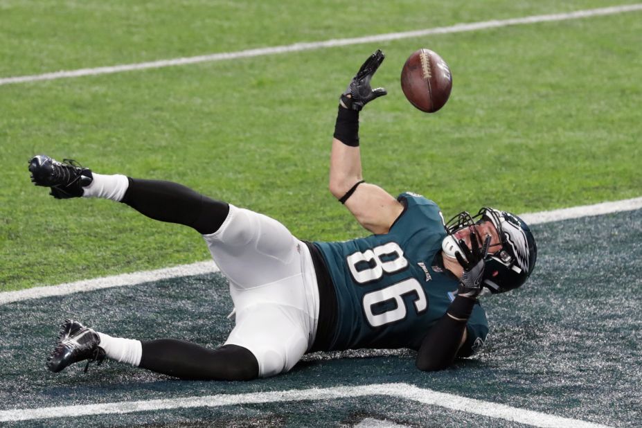 Ertz bobbles the ball after crossing the goal line. After a video review, the officials ruled that he had already completed the catch and crossed the line as a runner.