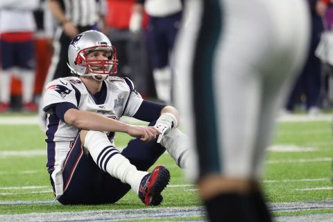 New England quarterback Tom Brady reacts after fumbling the ball late in the fourth quarter.
