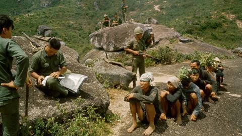 South Korean soldiers seen with a group of captured Vietcong prisoners.