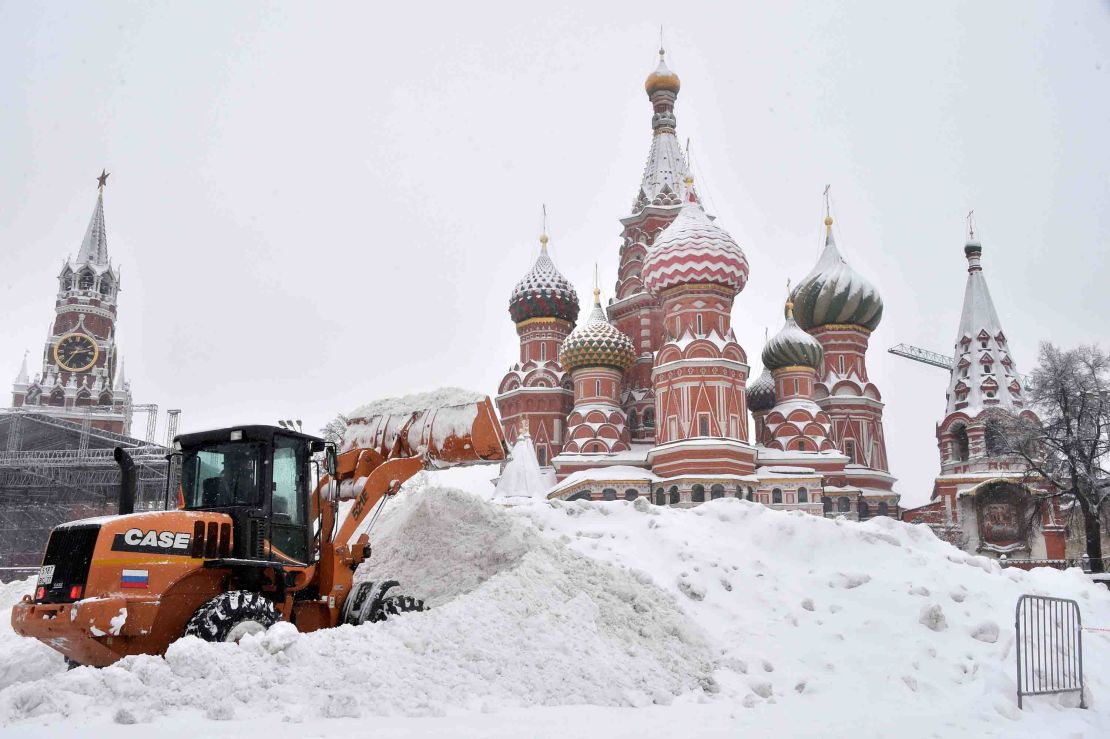A bulldozer plows through snow in Red Square in Moscow on Sunday, February 4.