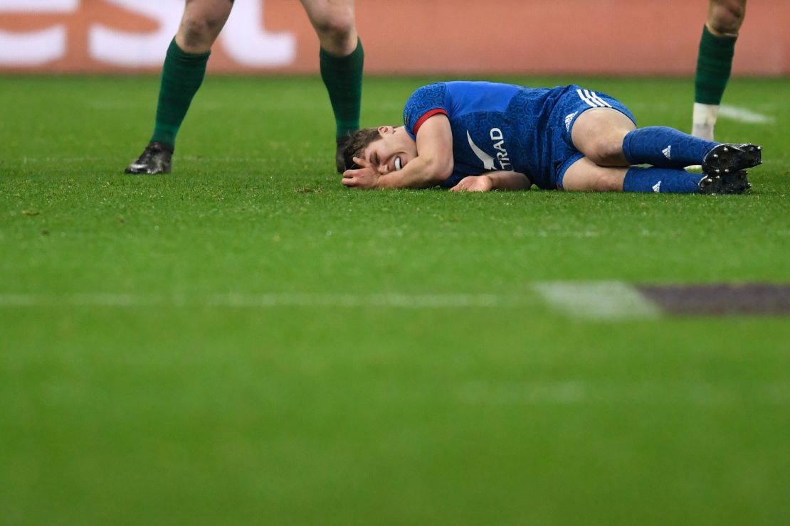 France's Antoine Dupont lies on the pitch after being injured during the Six Nations rugby union match between France and Ireland.
