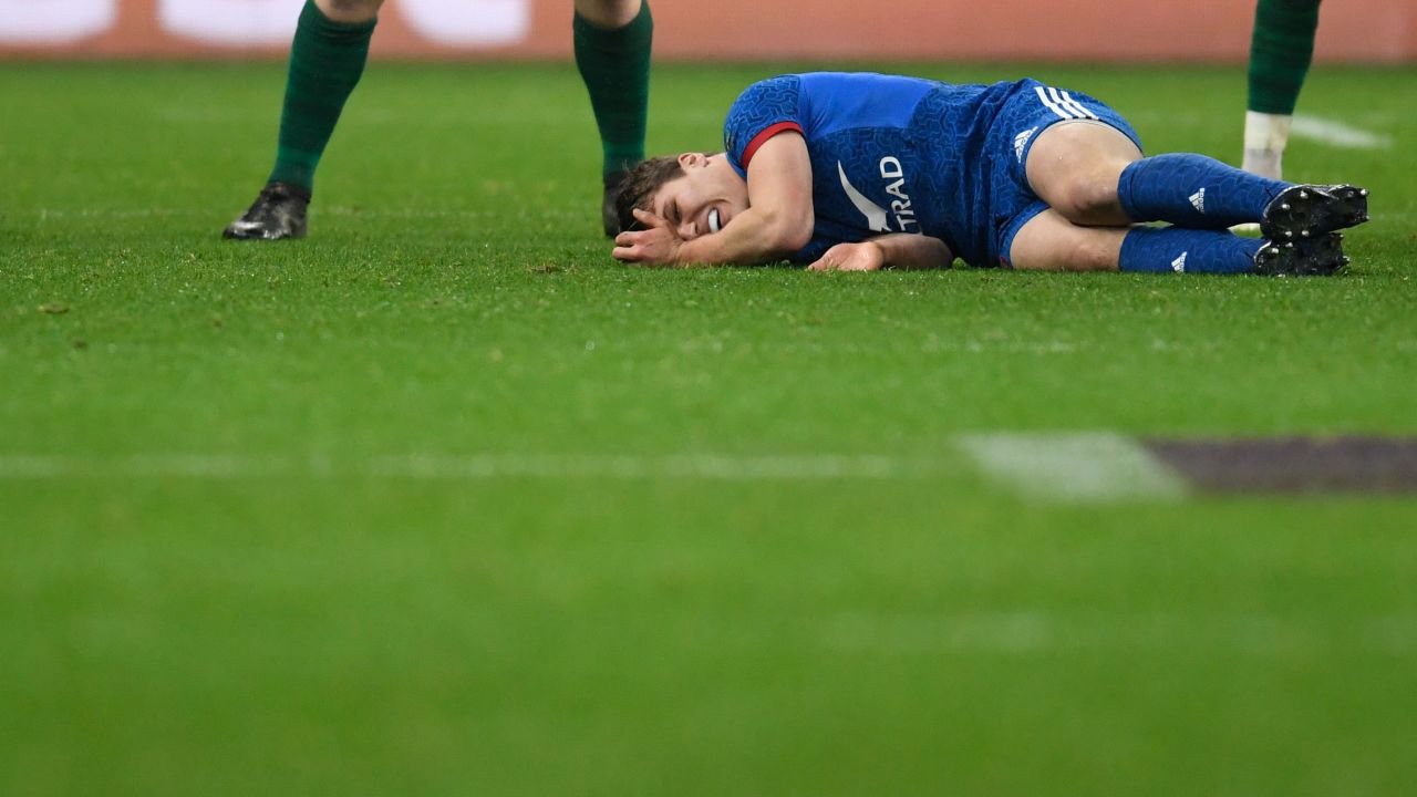 France's Antoine Dupont lies on the pitch after being injured during the Six Nations rugby union match between France and Ireland.