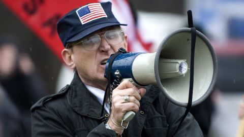 Arthur Jones shouts into a bullhorn during a protest at the dedication ceremony for the Illinois Holocaust Museum and Education Center in Skokie, Illinois, in April 2009.