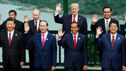 (Front L to R) China's President Xi Jinping, Vietnam's President Tran Dai Quang, Indonesia's President Joko Widodo, Japan's Prime Minister Shinzo Abe, (back L to R) Philippine President Rodrigo Duterte, Russia's President Vladimir Putin, US President Donald Trump, and Thailand's Prime Minister Prayut Chan-O-Cha pose during the "family photo" during the Asia-Pacific Economic Cooperation (APEC) leaders' summit in the central Vietnamese city of Danang on November 11, 2017.
World leaders and senior business figures are gathering in the Vietnamese city of Danang this week for the annual 21-member APEC summit. / AFP PHOTO / POOL / JORGE SILVA        (Photo credit should read JORGE SILVA/AFP/Getty Images)