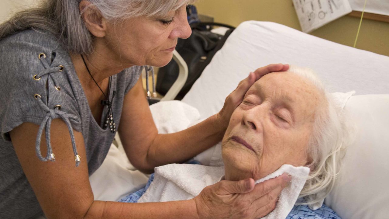 Laurel Cline visits her mother, Lenora, in a Los Angeles nursing home. She said she had to persuade staff to stop giving her mother antipsychotic drugs.
