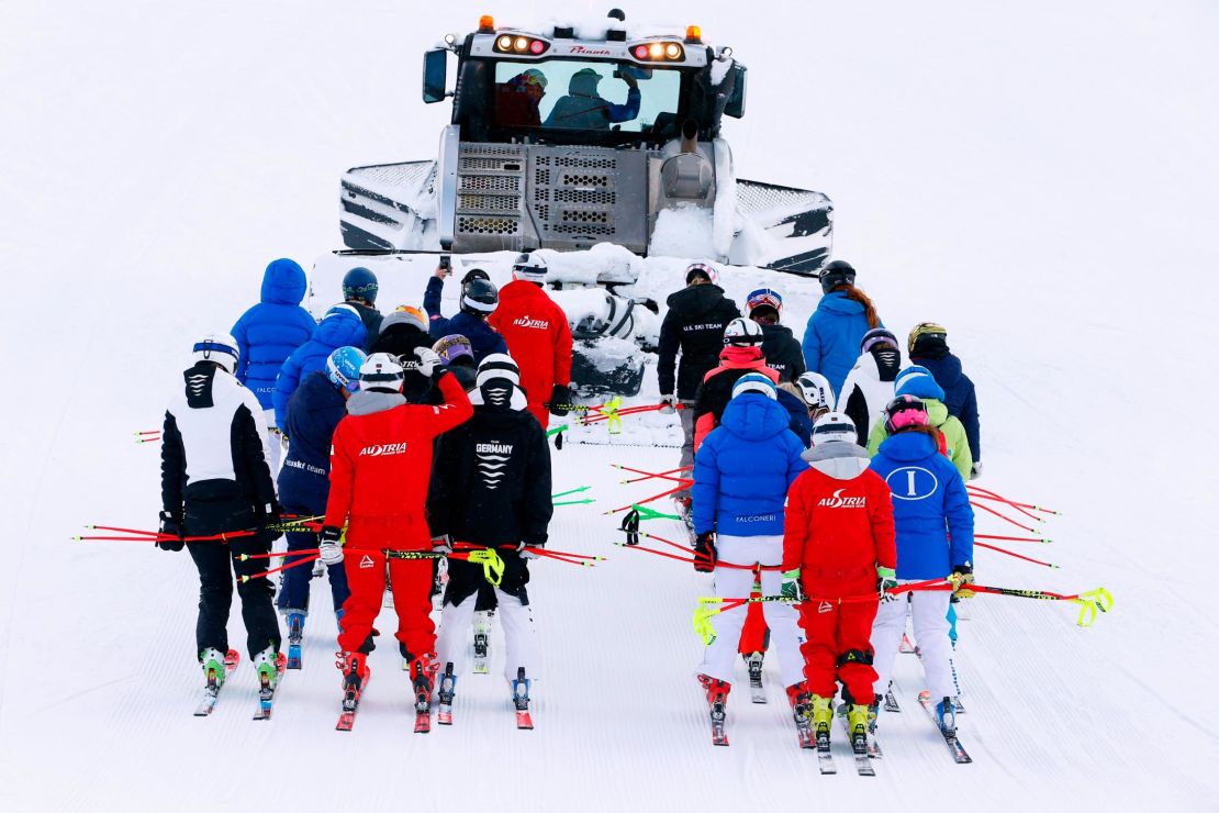 Teams go to inspects the course at Lake Louise.