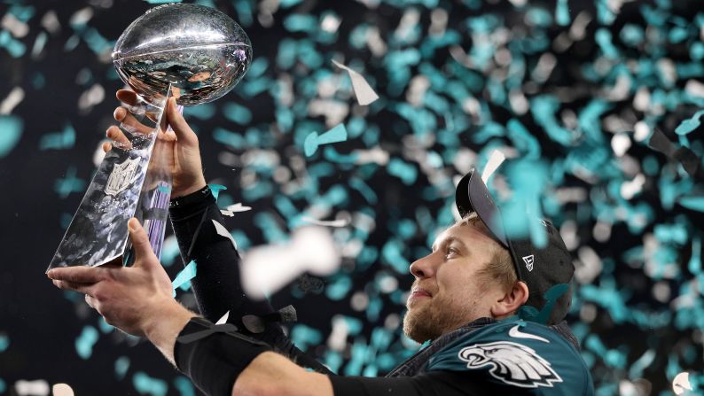 Philadelphia quarterback Nick Foles raises the Vince Lombardi Trophy after the Eagles won the <a href="index.php?page=&url=http%3A%2F%2Fwww.cnn.com%2F2018%2F02%2F04%2Fsport%2Fgallery%2Fsuper-bowl-lii%2Findex.html" target="_blank">Super Bowl</a> on Sunday, February 4. Foles threw for three touchdowns -- and even caught one -- in the Eagles' 41-33 victory over New England. He was named the game's <a href="index.php?page=&url=http%3A%2F%2Fwww.cnn.com%2F2015%2F01%2F25%2Fus%2Fgallery%2Fsuper-bowl-mvps%2Findex.html" target="_blank">Most Valuable Player.</a>