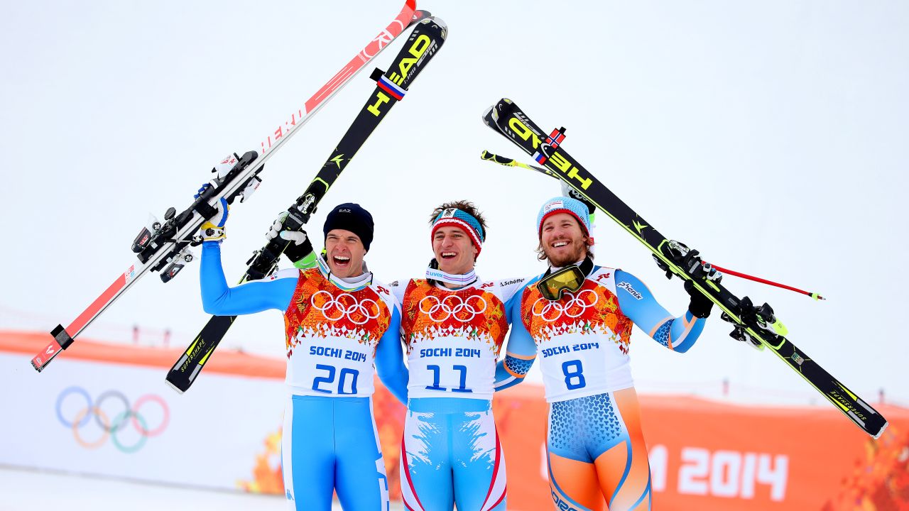 Silver medalist Christof Innerhofer of Italy (left), gold medalist Matthias Mayer of Austria (center) and bronze medalist Kjetil Jansrud of Norway (right) celebrate at Sochi 2014.