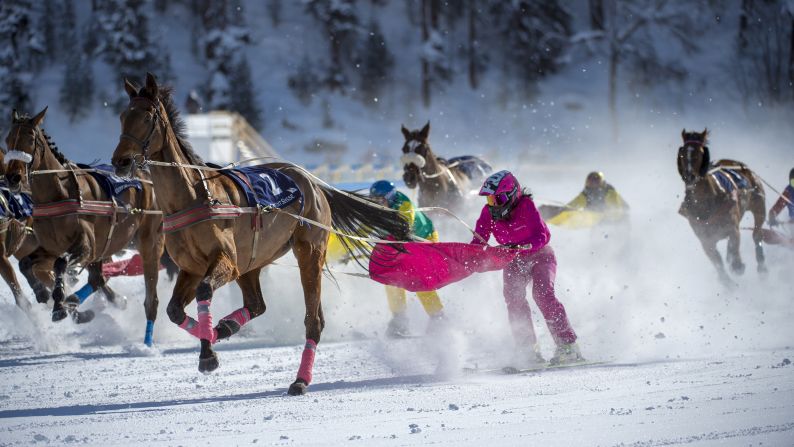 Valeria Holinger, in pink, holds onto Usbekia on their way to winning the Skijoring Grand Prix of Celerina, which took place in St. Moritz, Switzerland, on Sunday, February 4. In skijoring, a skier is pulled by a horse. Some variations of the sport have the skier pulled by dogs or a motor vehicle such as a snowmobile.