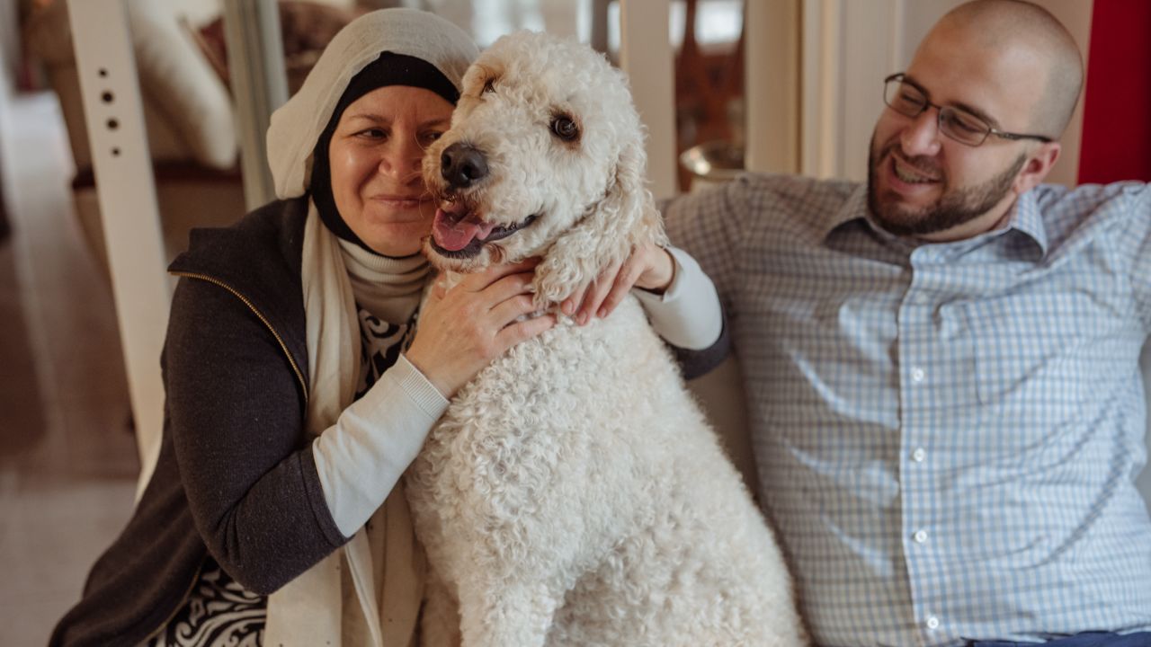 After Deah was killed, a darkness descended on Farris and Layla. Their dog AJ makes them smile.