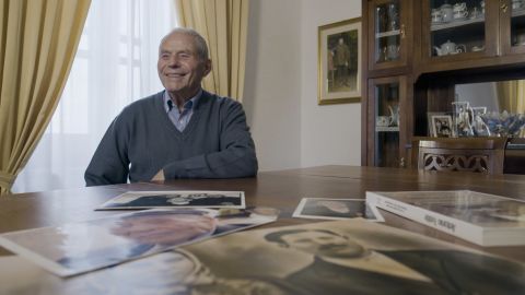 Tonino, the son of the world's first man to live to 110 years old, reflects on pictures of his late father.