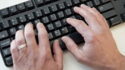 A man types on a computer keyboard in this photo illustration taken in Washington, DC, November 21, 2016.
Almost half of US internet users say they have been a victim of online harassment or abuse ranging from name-calling to stalking to physical threats, a survey showed November 21, 2016. Women, the under-30s, and people identifying as lesbian, gay, or bisexual were all more likely to experience such harassment -- and were also more likely to self-censor what they post online as a result, researchers found.More than a third (36 percent) had suffered "direct harassment," including being called offensive names, threatened physically or stalked.
 / AFP PHOTO / SAUL LOEB        (Photo credit should read SAUL LOEB/AFP/Getty Images)