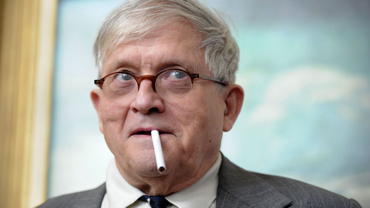 British artist David Hockney poses for photographers with a cigarette during the press view of his forthcoming exhibition entitled 'David Hockney: A Bigger Picture' at the Royal Academy of Arts in central London (2011).