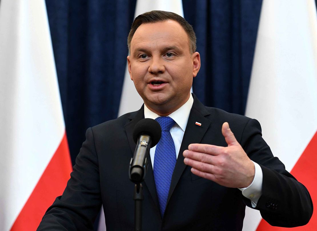 Poland's President Andrzej Duda  announces he would sign the controversial Holocaust bill into law.