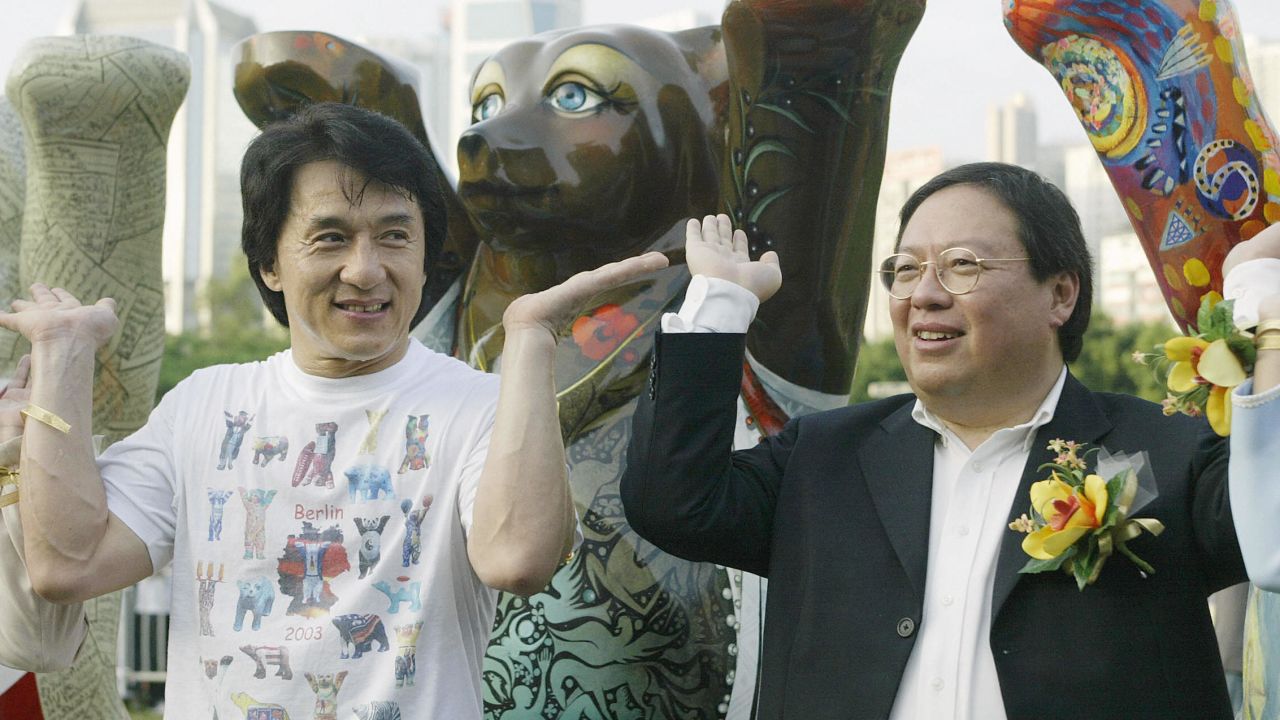 Film star Jackie Chan (left) and the then Hong Kong Home Affairs secretary Patrick Ho pose at an event raising money for the Jackie Chan Charitable foundation, the United Nations Children's Fund and the Community Chest.  