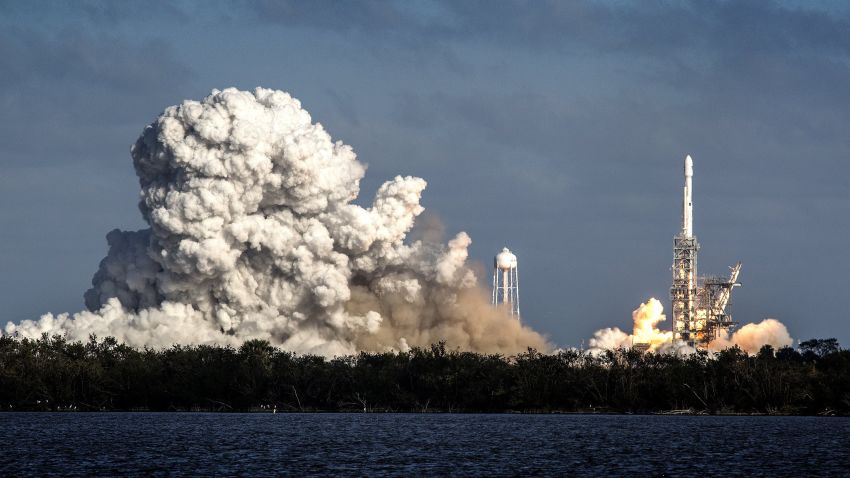 epa06501132 The SpaceXâ€™s Falcon Heavy rocket takes off from Cape Kennedy in Florida, USA on 06 February 2018. SpaceX, founded by Elon Musk, will launch its Falcon Heavy rocket, the most powerful rocket in the world. As part of its payload the Falcon Heavy is carrying Muskâ€™s cherry red Roadster from Tesla, his electric car company.  EPA/CRISTOBAL HERRERA