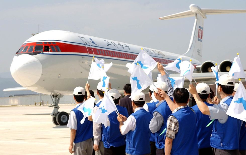 South Koreans wave unification flags as North Korean athletes arrive in Busan, South Korea, for the 2002 Asian Games. The Korean Unification Flag was first used in 1991, and has been used by the two nations at the opening ceremonies of the 2000, 2004 and 2006 Olympic Games.