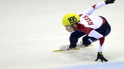 Viktor Ahn of Russia competes during the men's 1500m preliminaries of the ISU World Cup short track speed skating event in Dresden, eastern Germany, on February 6, 2015.  AFP PHOTO / ROBERT MICHAEL        (Photo credit should read ROBERT MICHAEL/AFP/Getty Images)
