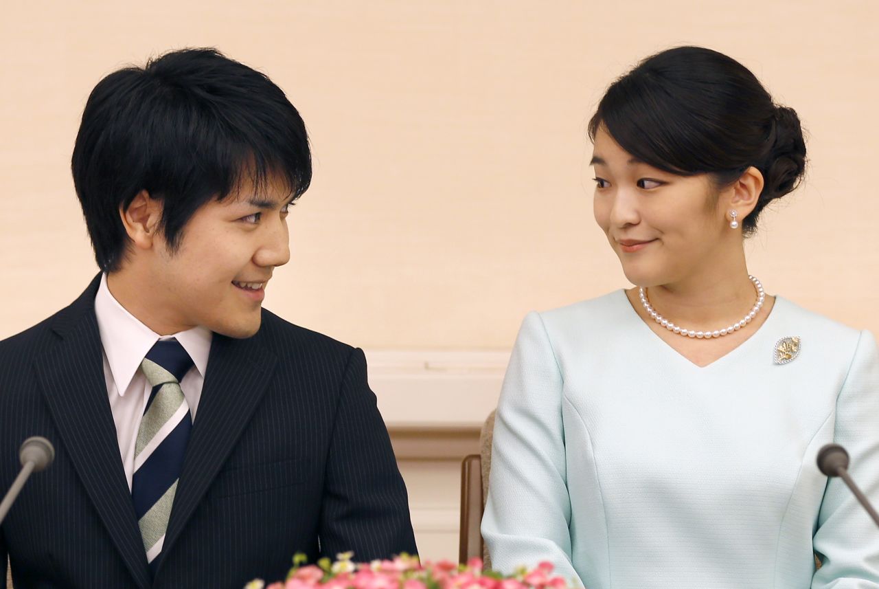 Princess Mako, right, the eldest daughter of Prince Akishino and Princess Kiko, and her fiancé Kei Komuro smile during a news conference to announce their engagement on September 3, 2017.