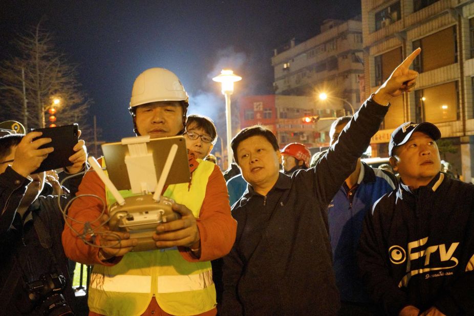 Rescue workers check the area affected by the quake in Hualien.