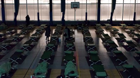 People stranded by the snow rest in an emergency shelter installed at the Robert Wagner gymnasium in Velizy-Villacoublay, southwestern suburbs of Paris.